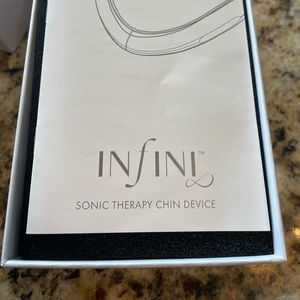 Infini Sonic therapy chin device. Brand new. Never used. Original box